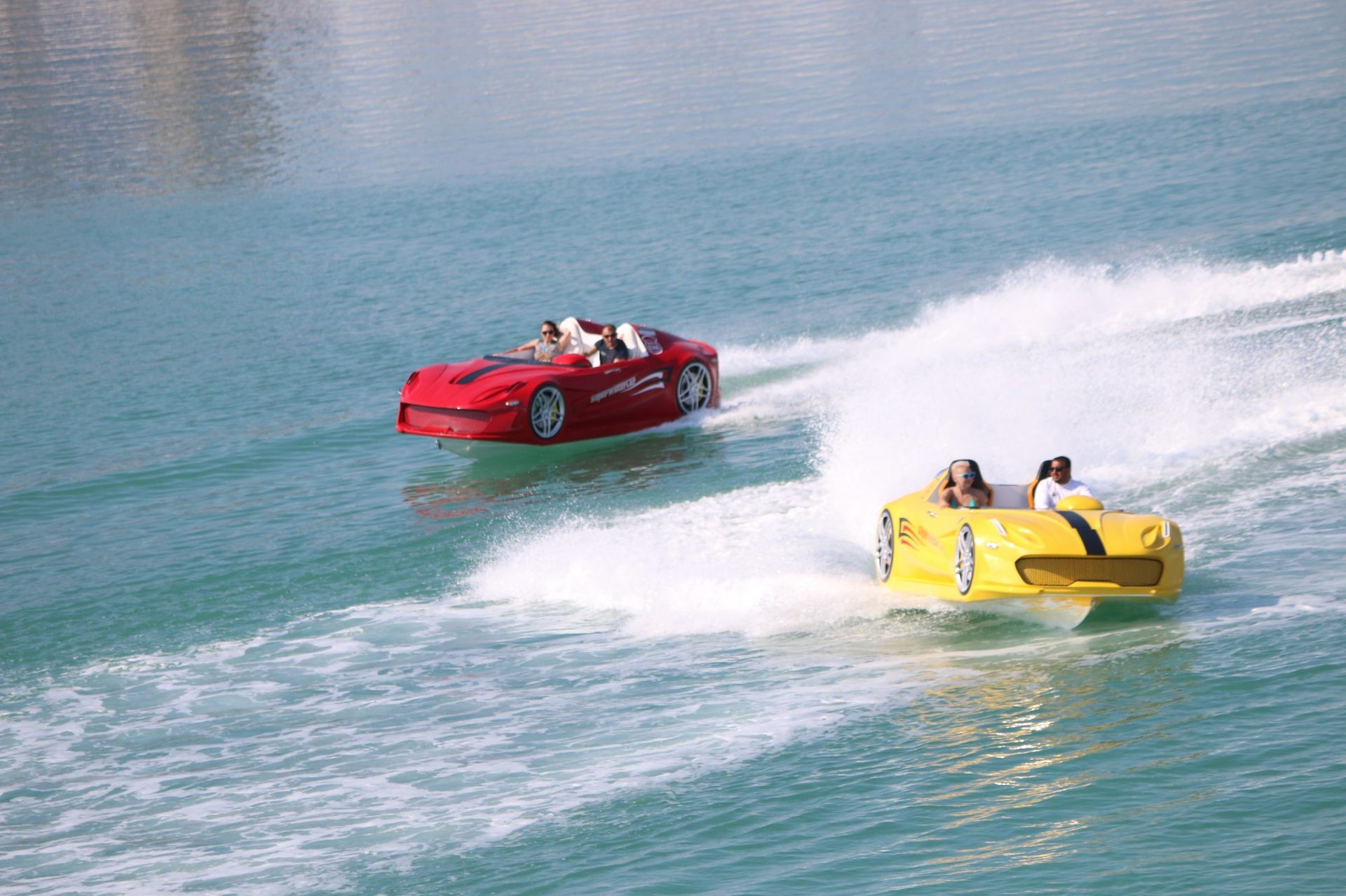 Red and yellow Super Water Car jet car watercraft racing side by side in UAE waters